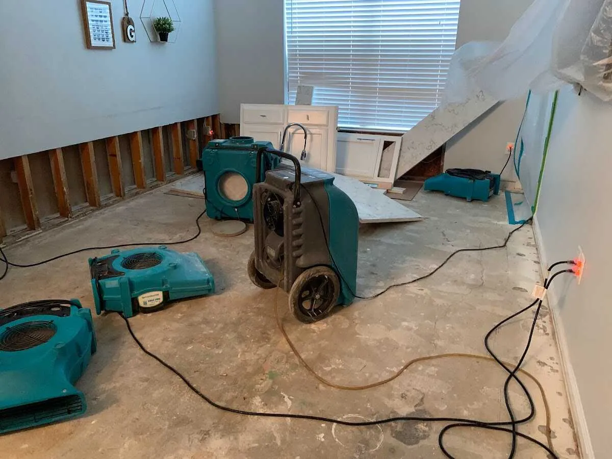 Dehumidifier in flood-cut room for Water Damage Restoration in Gallup